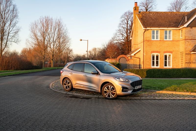 Ford Kuga parked on the kerb near house